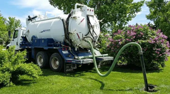 Professional vacuum truck performing residential drainage and septic maintenance in Marietta, GA